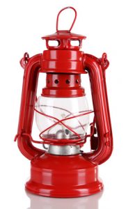 Red kerosene lamp isolated on white